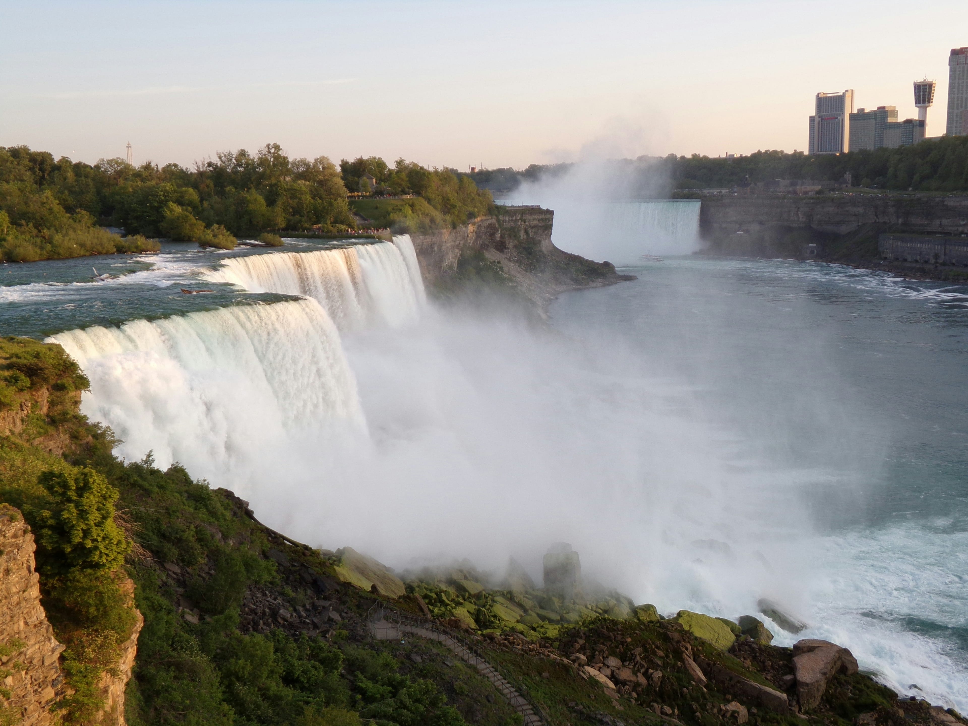 Niagara Falls powerful waterfall with mist rising on the border of USA and Canada